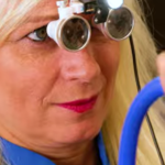 Claire carefully removing ear wax using microsuction